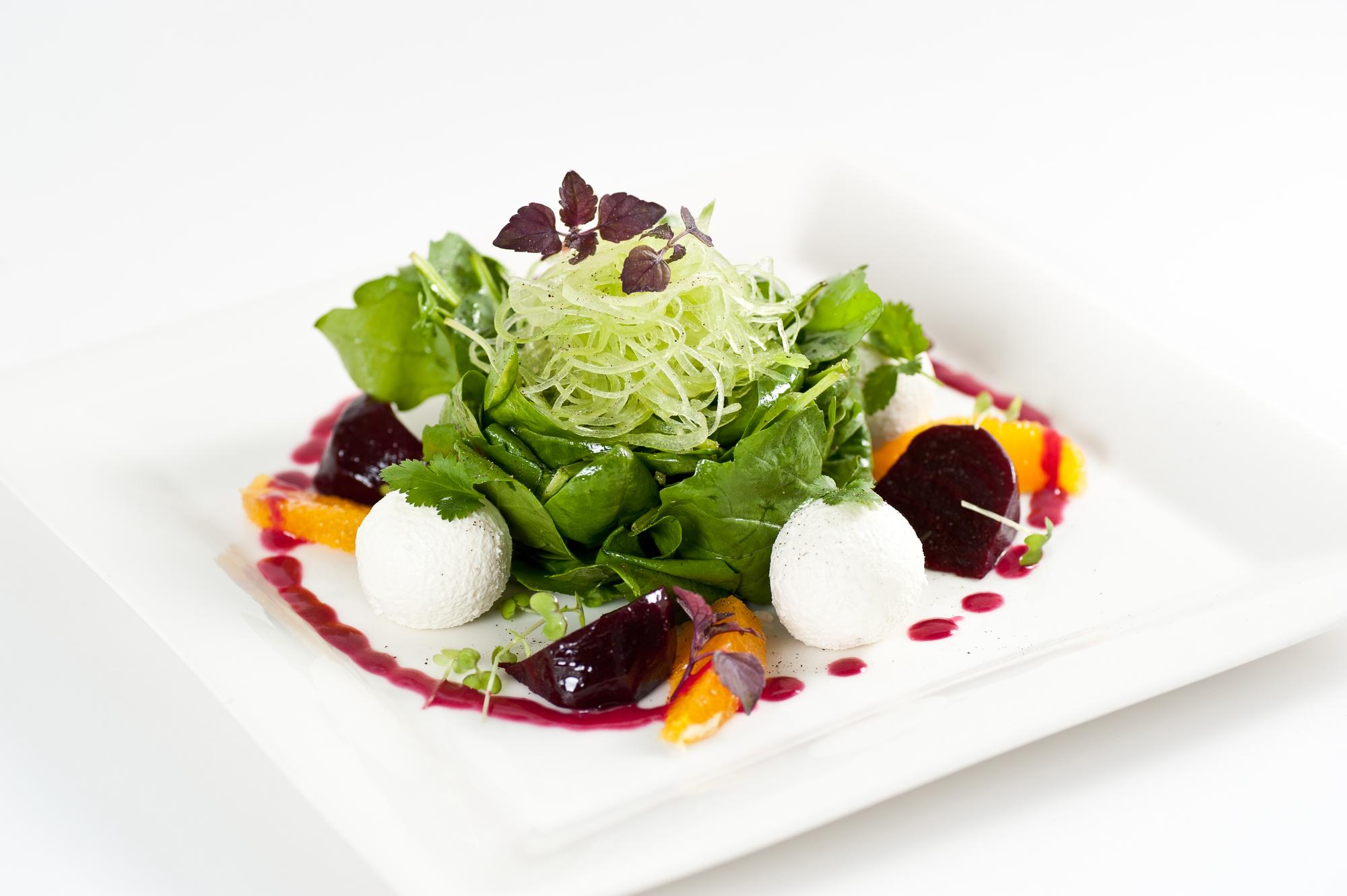 Plated seasonal salad with edible flowers